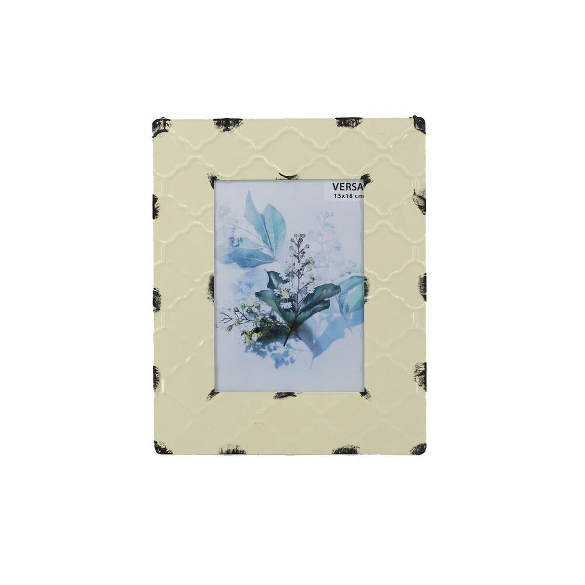 Cream enamelled metal photo frame with quatrefoil relief and brushed black corners, holding a 13 x 18 cm print