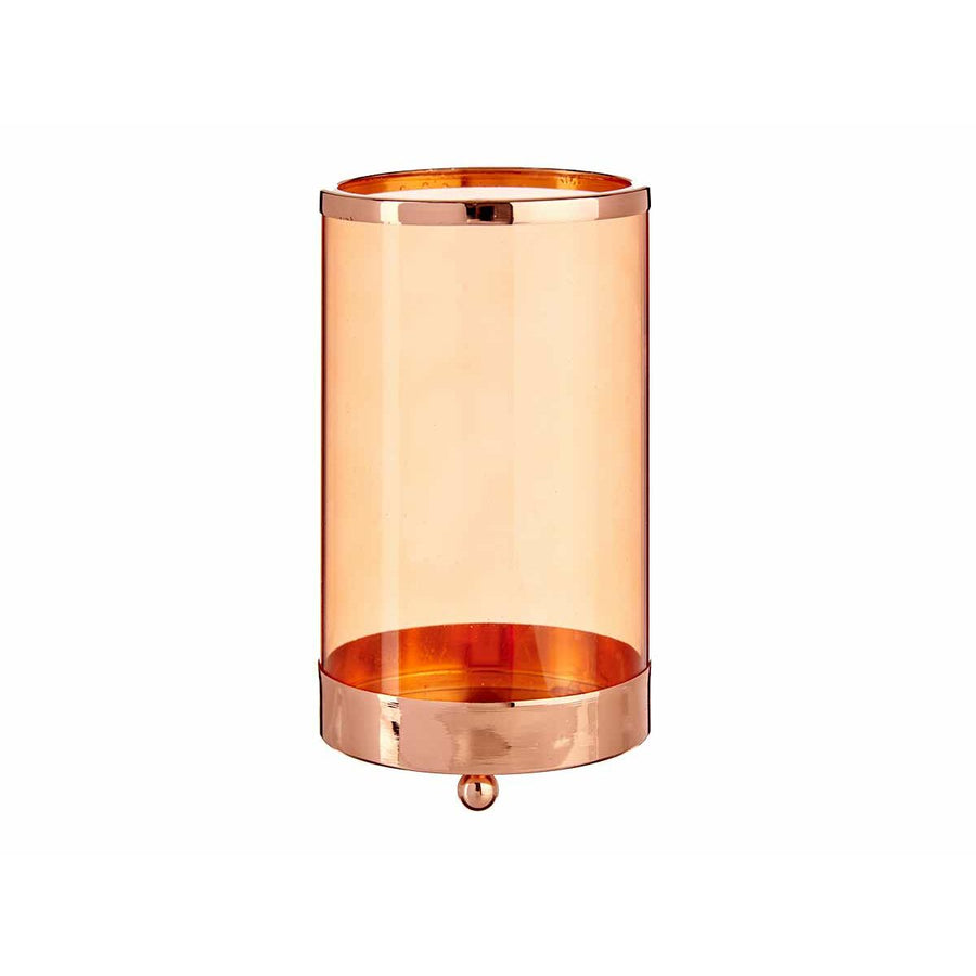Cylinder candle holder with an amber glass sleeve and copper-finish metal base