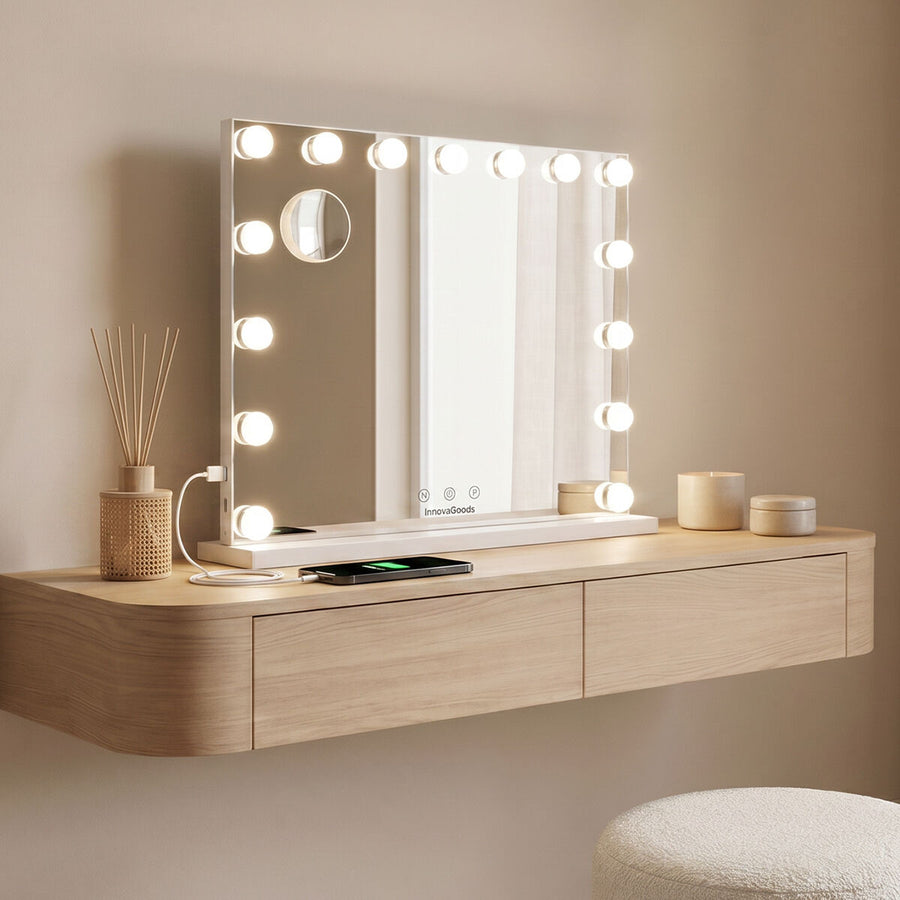 White LED vanity mirror with 15 Hollywood-style bulbs on a wooden dressing console, a phone charging from its USB port